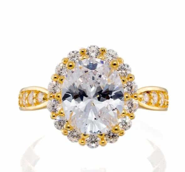 Oval Cut Fancy Halo Cubic Zirconia Engagement Ring In Yellow Gold Plated Sterling Silver