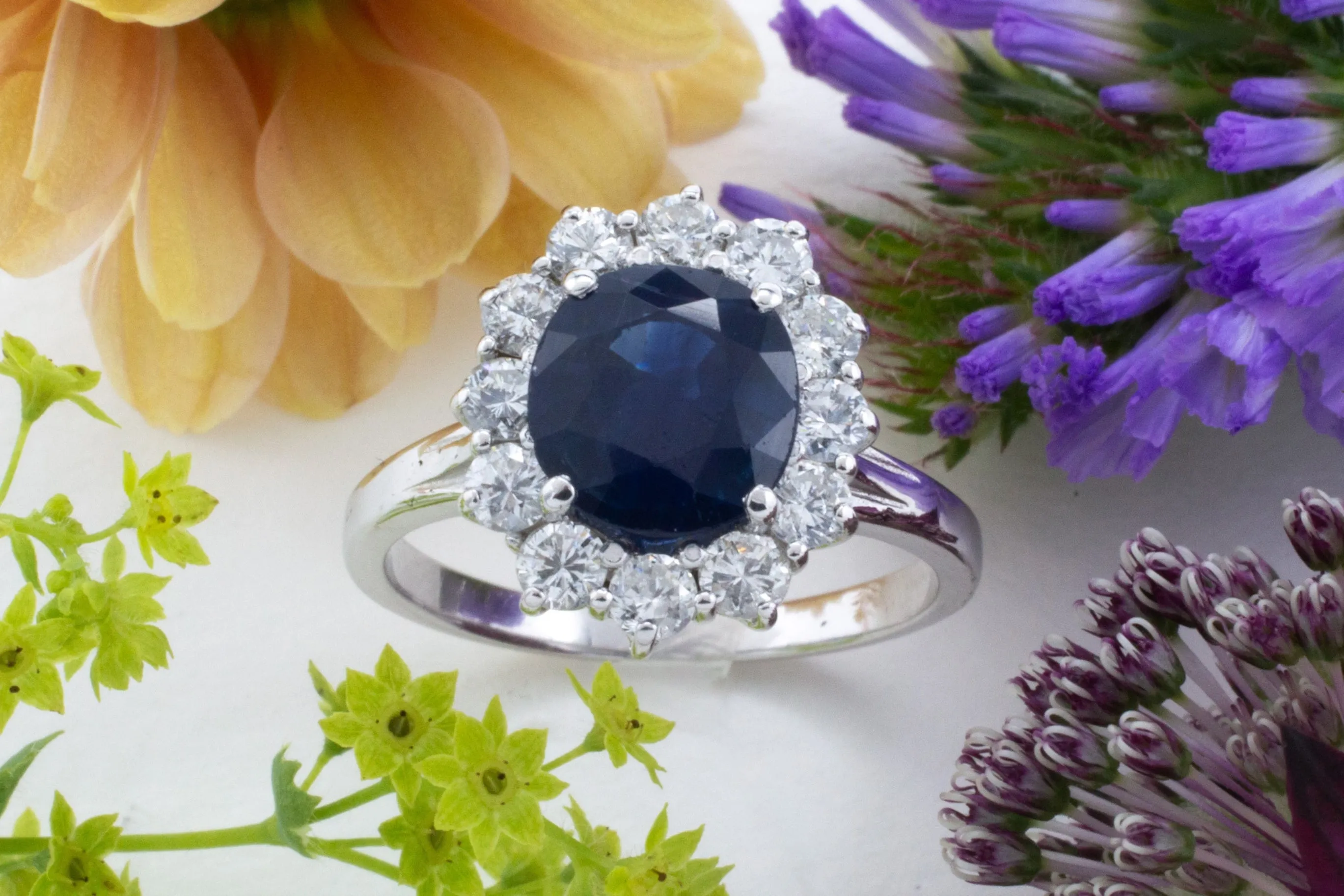 Sapphire and diamond cluster ring in white gold