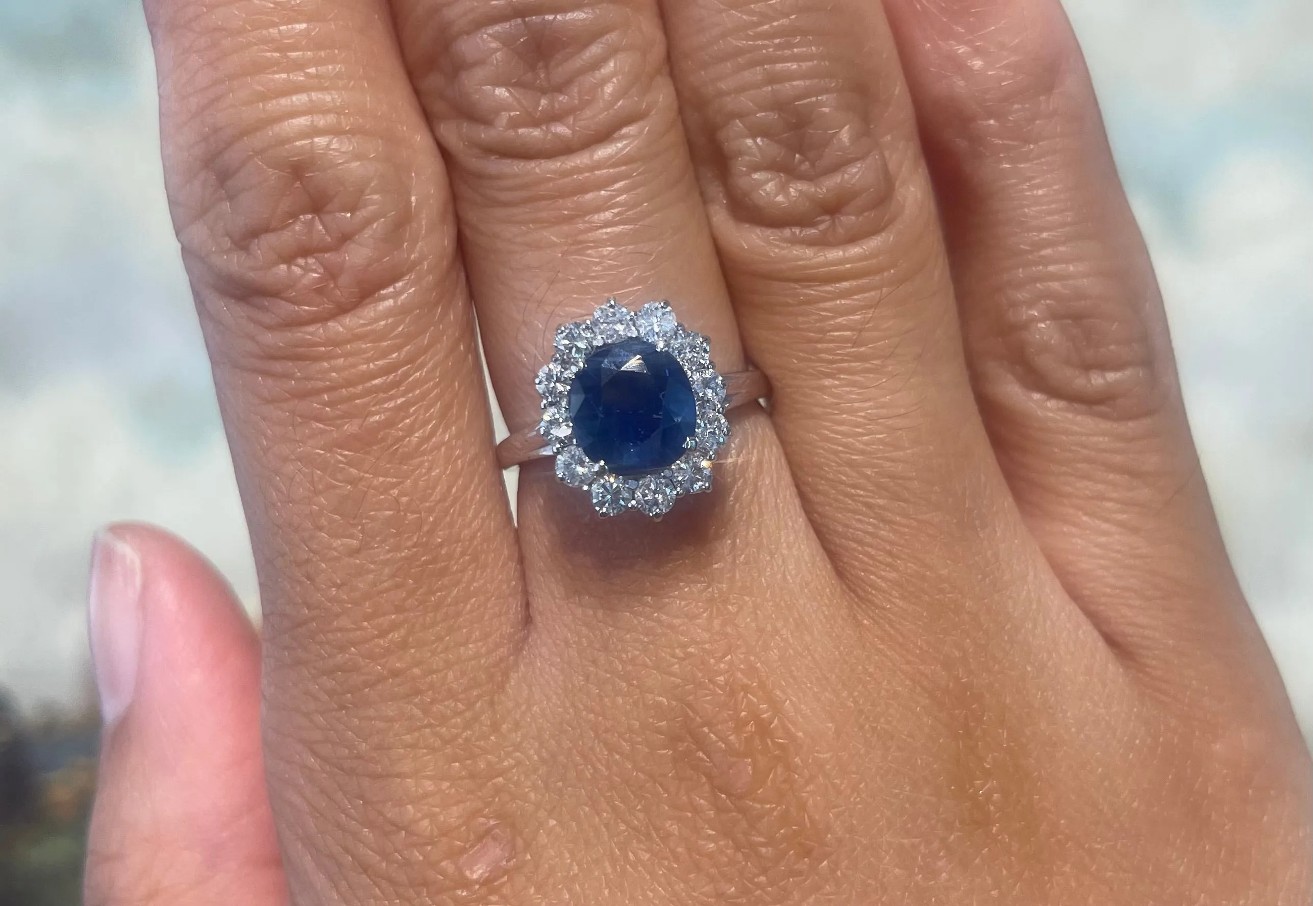 Sapphire and diamond cluster ring in white gold